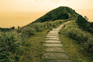 Fairy tale landscape and stepping stone path over a hill on the horizon at the Caoling Historic Trail in Taiwan