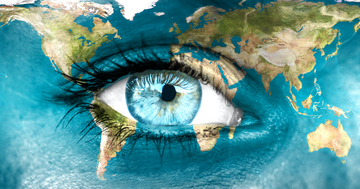 Planet earth and blue human eye – “Elements of this image furnished by NASA”